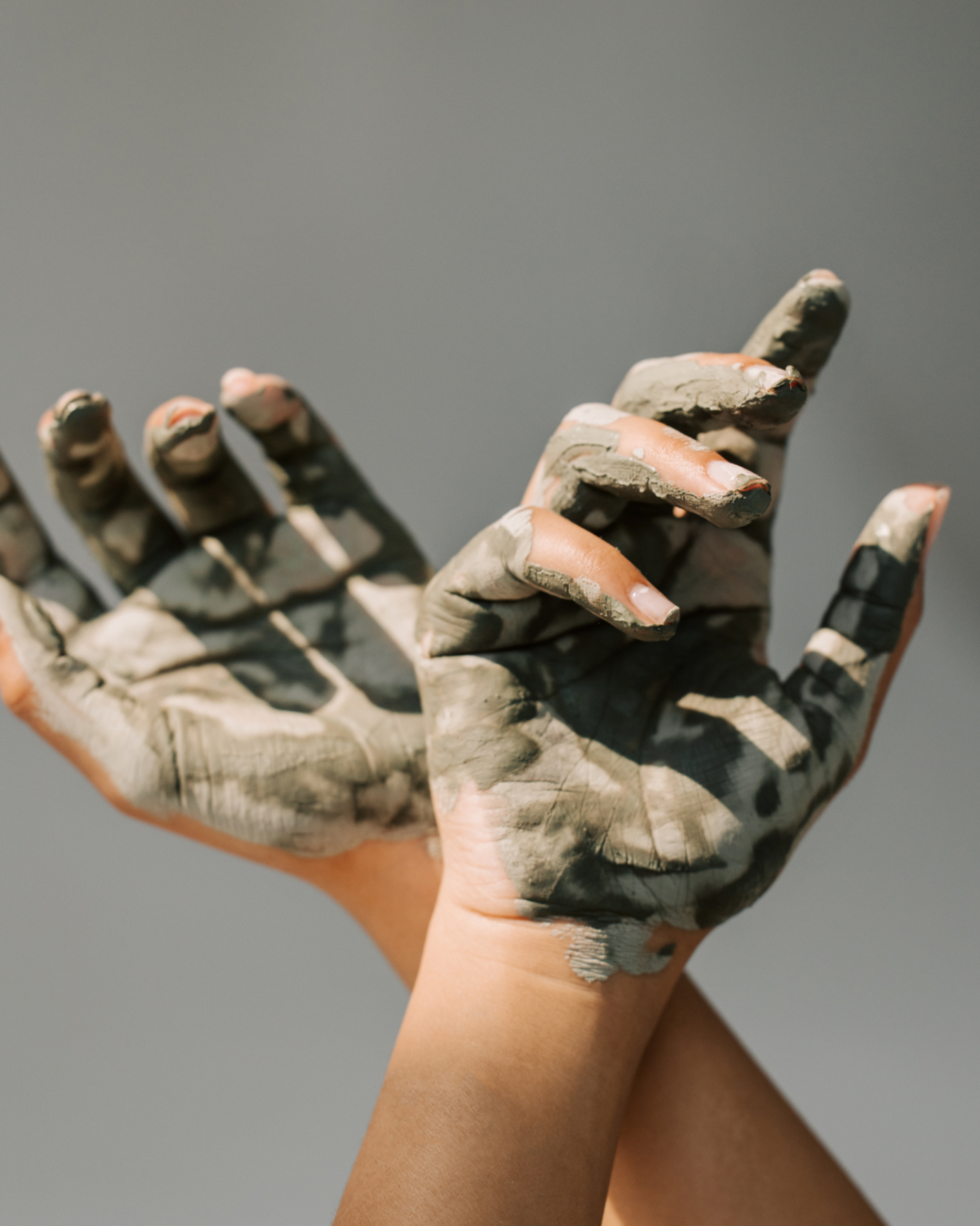 Close-up of Bunnyroo Mud Mask on fingers