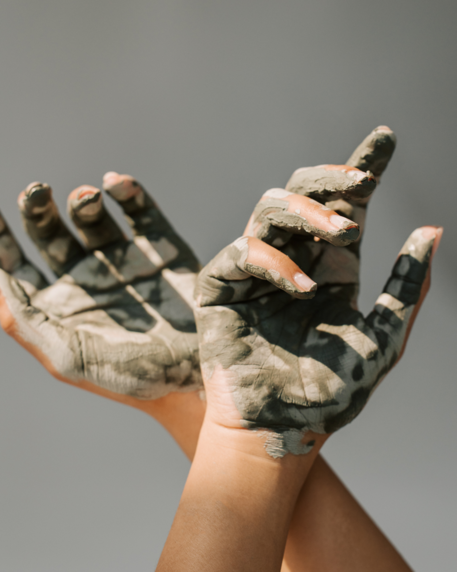 Close-up of Bunnyroo Mud Mask on fingers